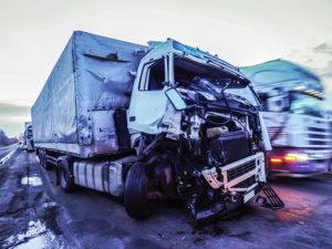 Truck with dented cab after rear-end collision