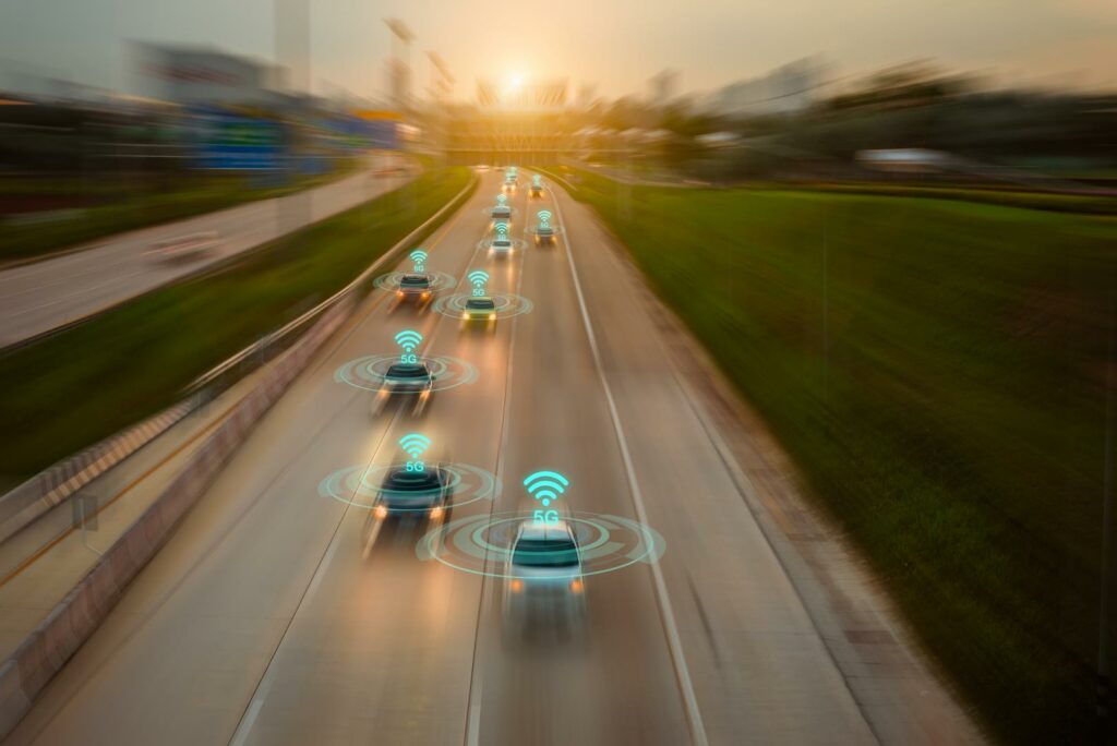 Picture of car on a motorway with indicated 5G WLan symbol on the roof