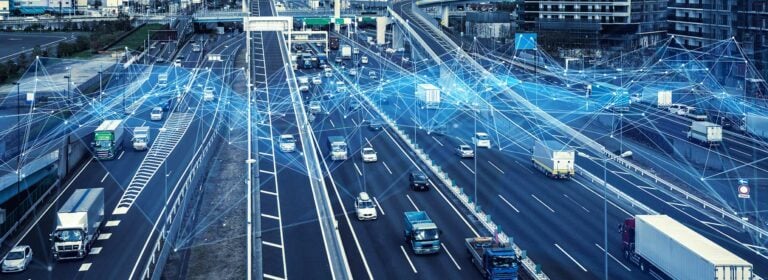 Connected trucks and cars on a street as symbol pic for digitalization in logistics