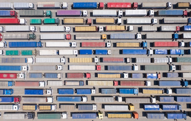 How digital transformation drives sustainability in logistics, Many trucks in a traffic jam