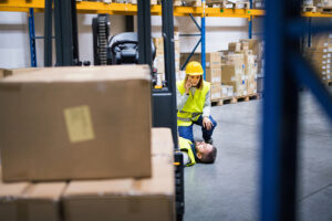 Female warehouse worker simulating in a gaming approach a dangerous situation