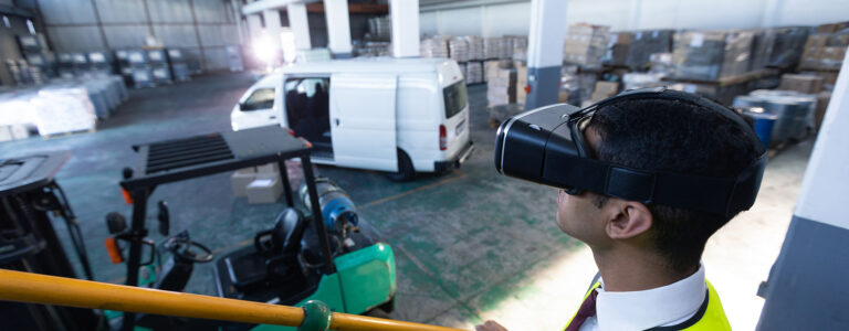 Business man with VR glasses observing warehouse